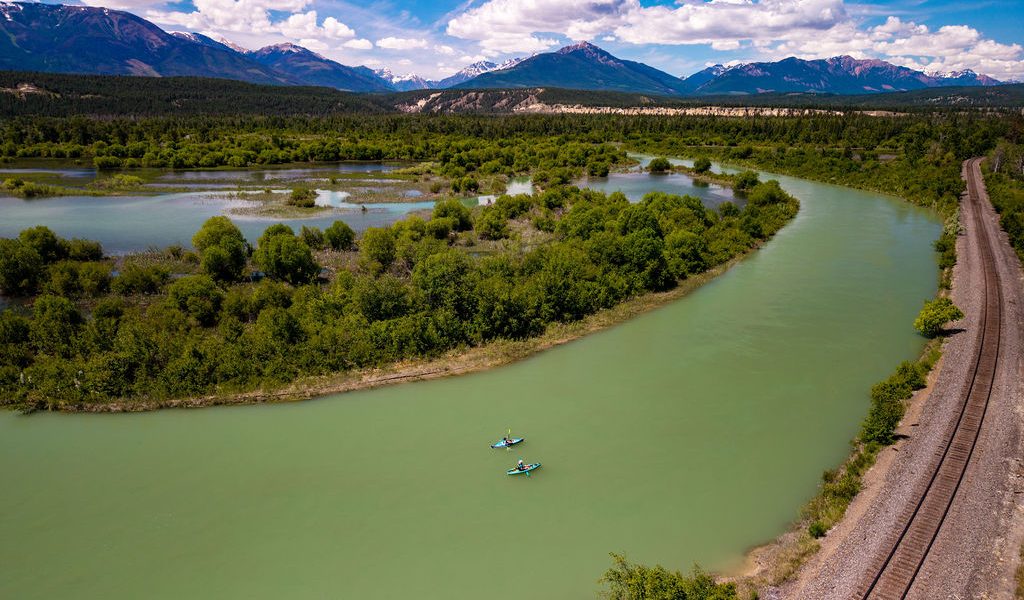 Two people kayaking Columbia River Invermere to Radium