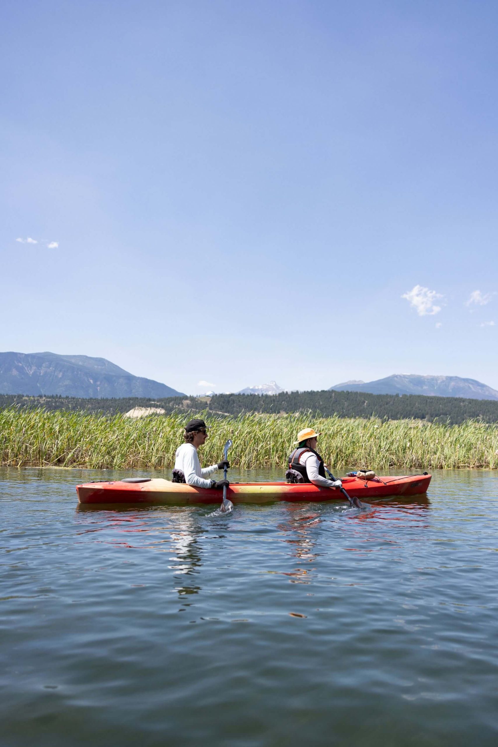 People in red kayak on Columbia River float